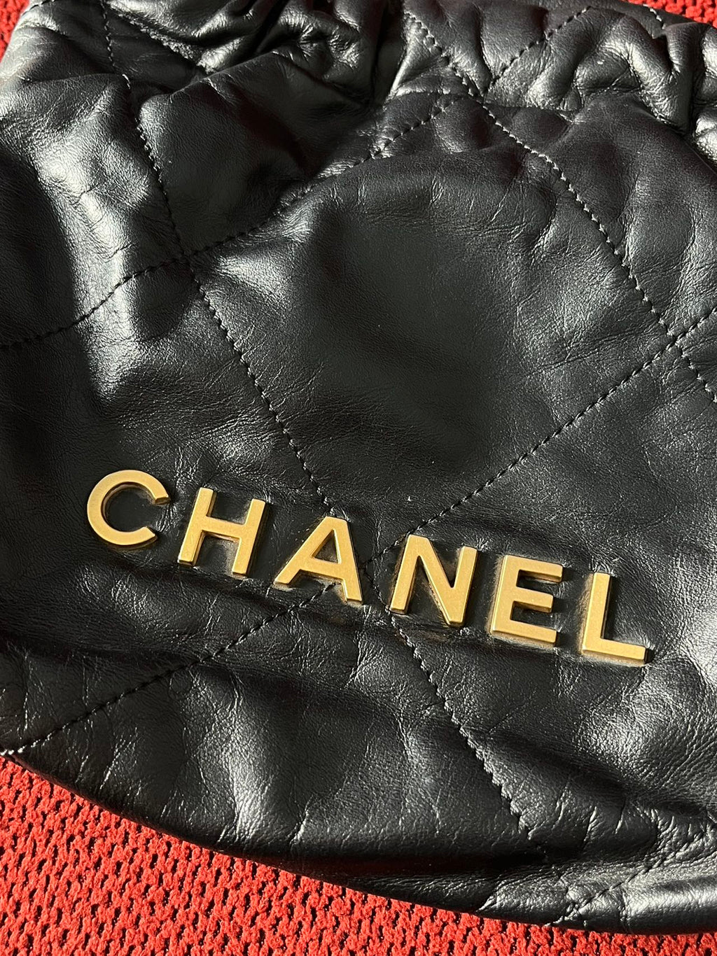 Chanel 22 bucket bag mini black shiny calfskin gold hardware