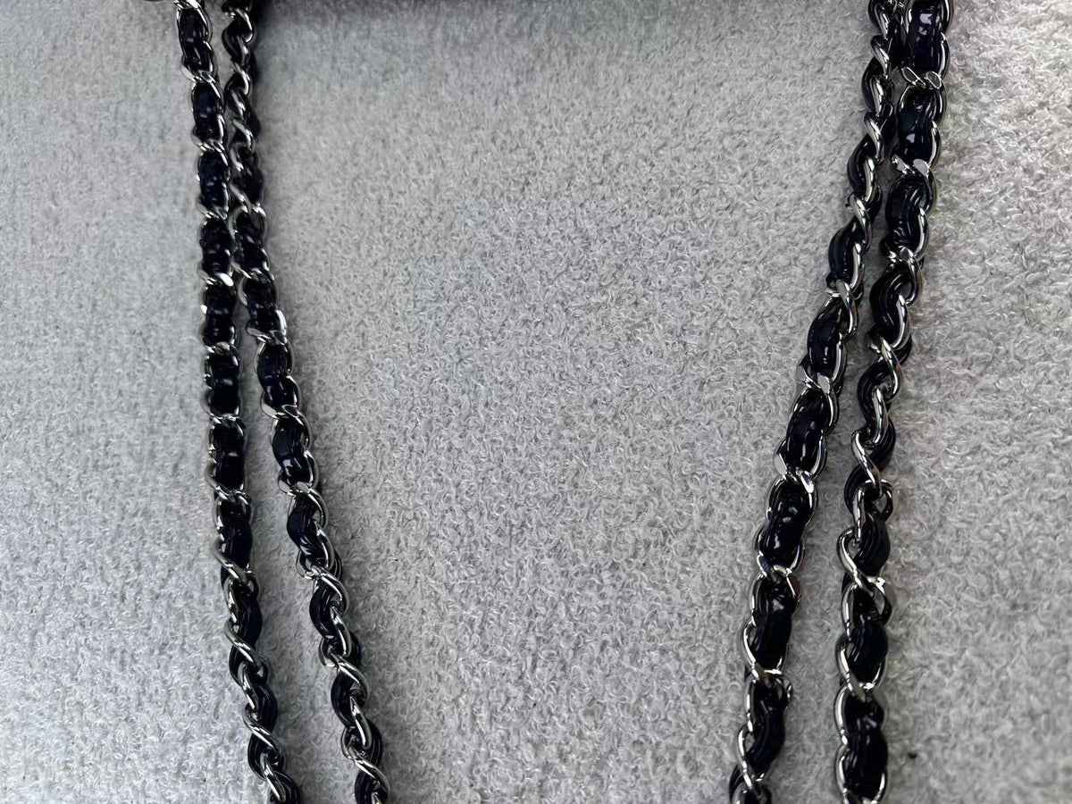 Chanel double flap bag black patent jumbo