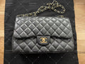 Chanel Timeless Classic double flap bag black jumbo gold hardware lambskin