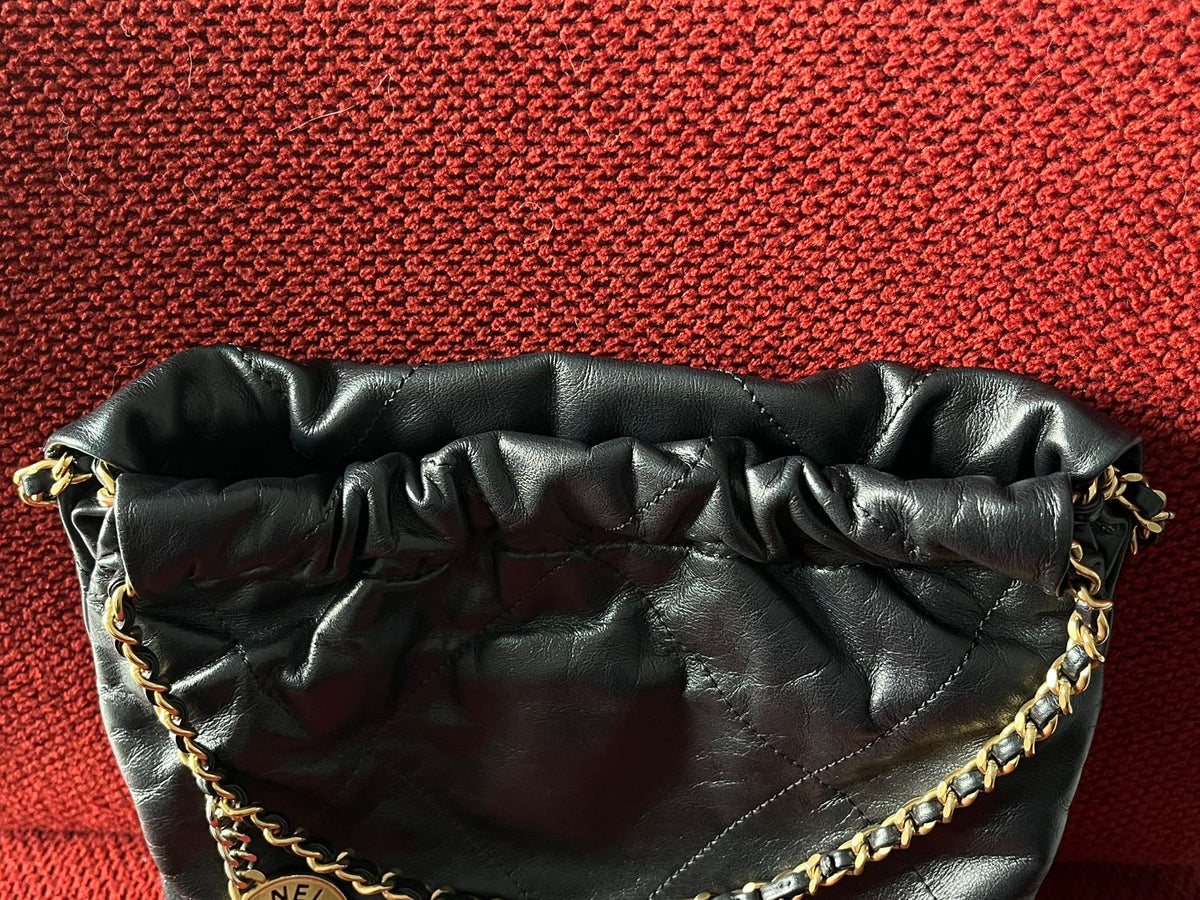 Chanel 22 bucket bag mini black shiny calfskin gold hardware