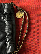 Chanel 22 bucket bag mini black shiny calfskin gold hardware