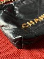 Chanel 22 bucket bag mini black shiny calfskin gold hardware