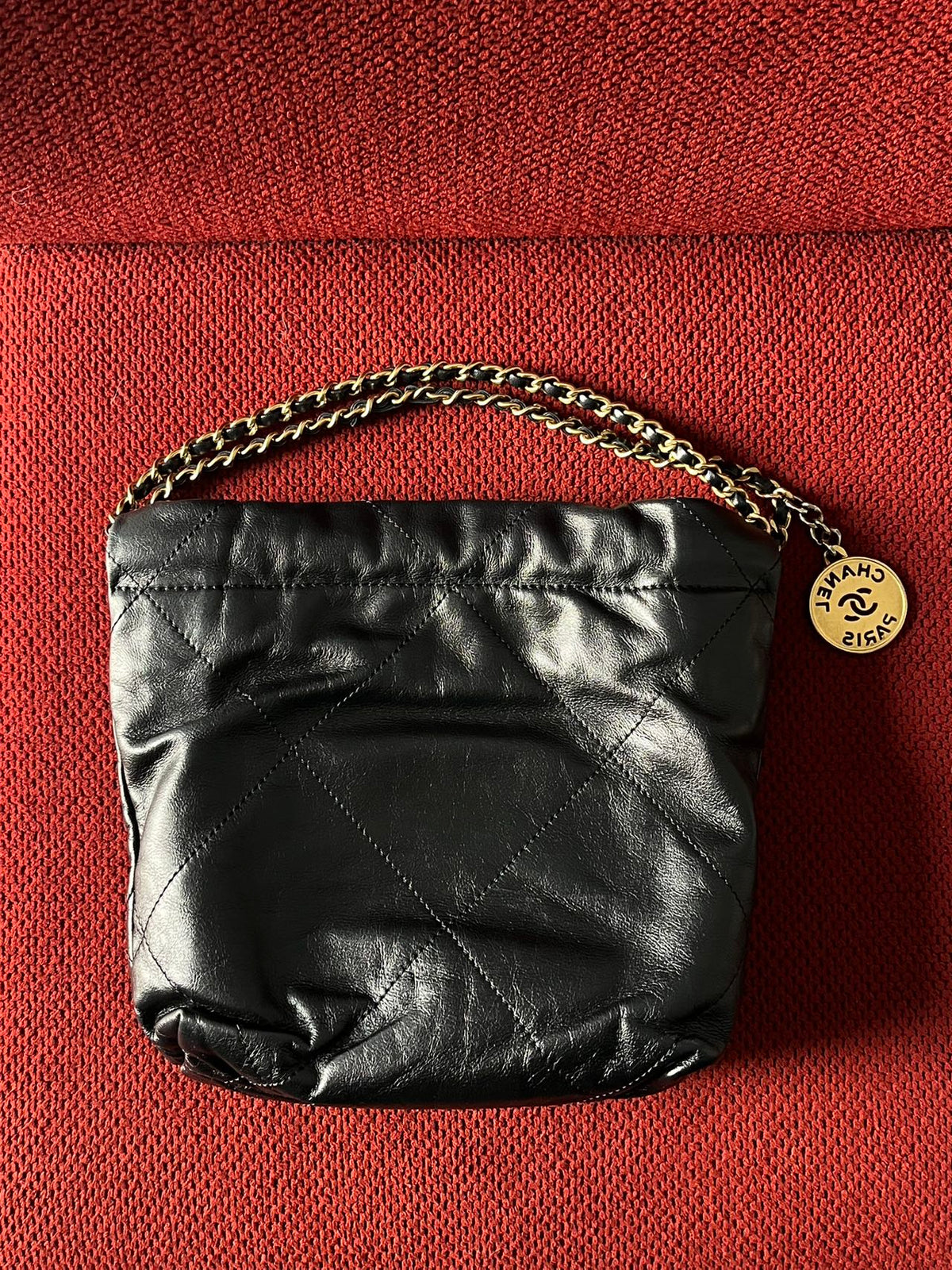Chanel 22 bucket bag mini black shiny calfskin gold hardware
