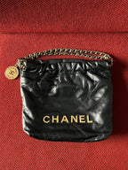 Chanel 22 bucket bag mini black shiny calfskin gold hardware