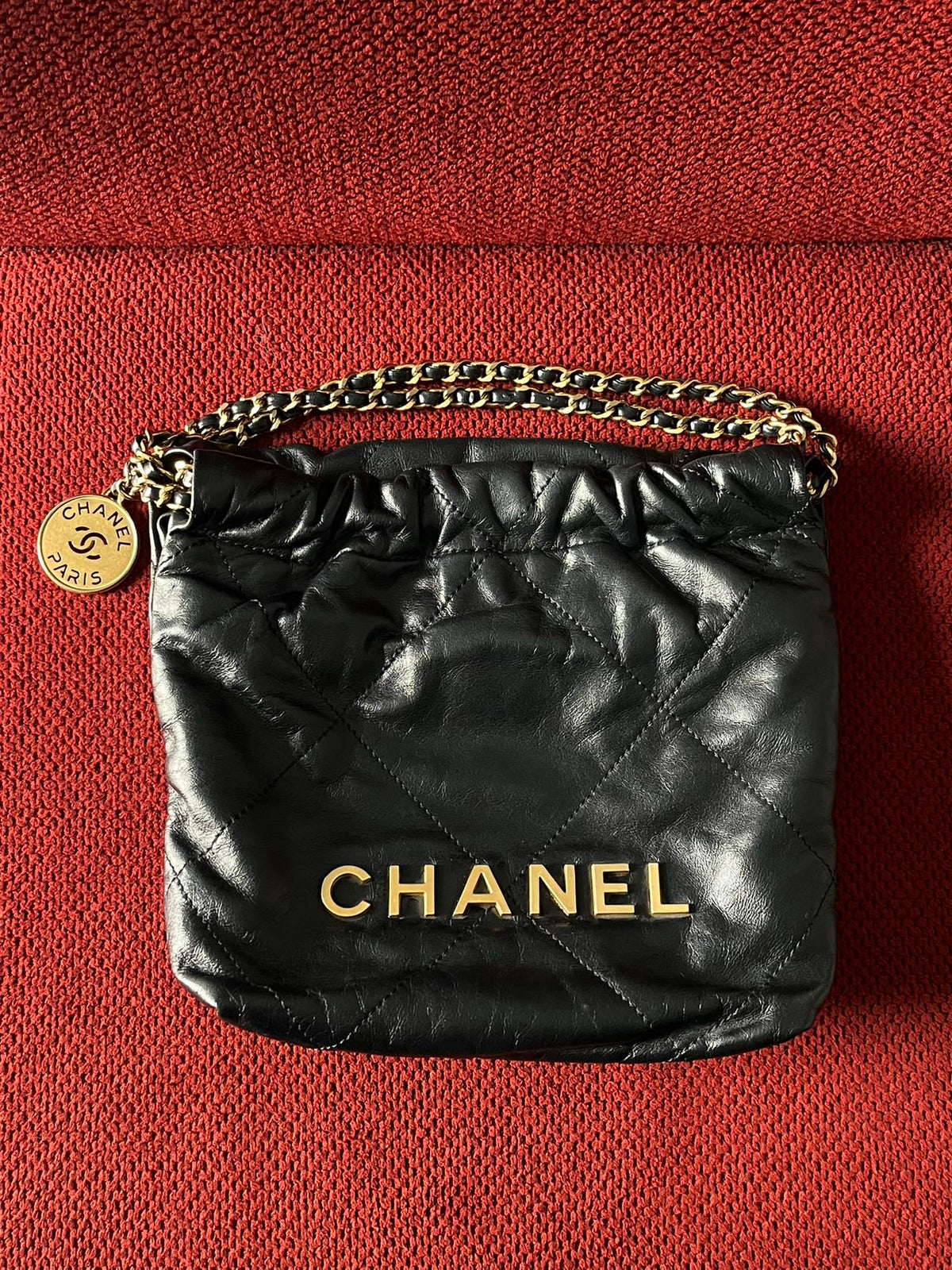 Chanel 22 bucket bag mini black shiny calfskin gold hardware